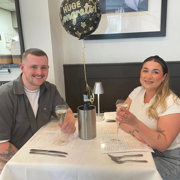 Bar Aldos customers with wines in their hands in Alloa. 